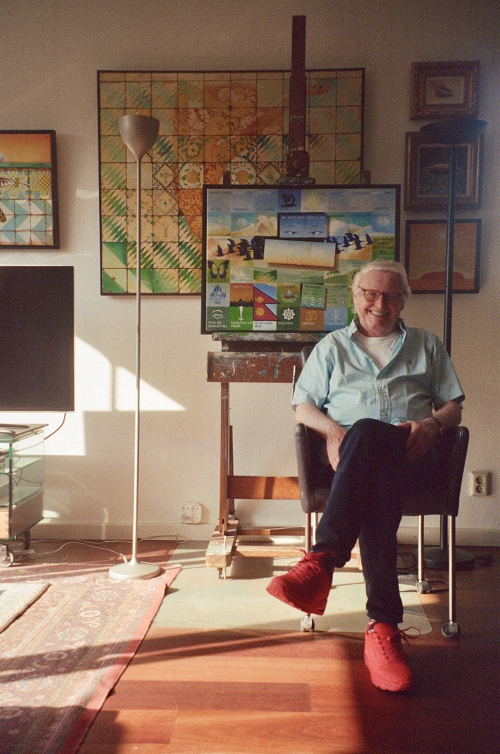Dick Mirande in his studio, surrounded by his paintings